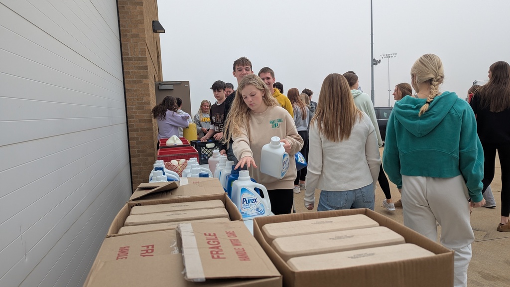 NHS students putting together Thanksgiving baskets for families in need