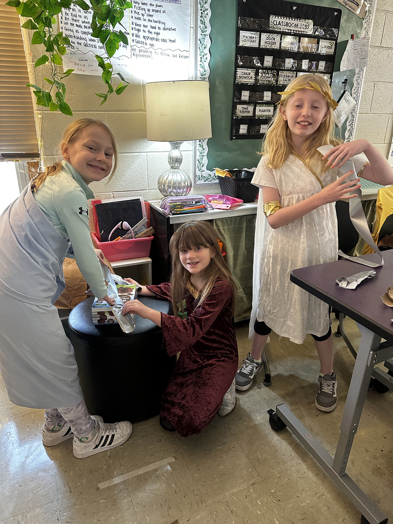 Third graders building and testing aquaducts