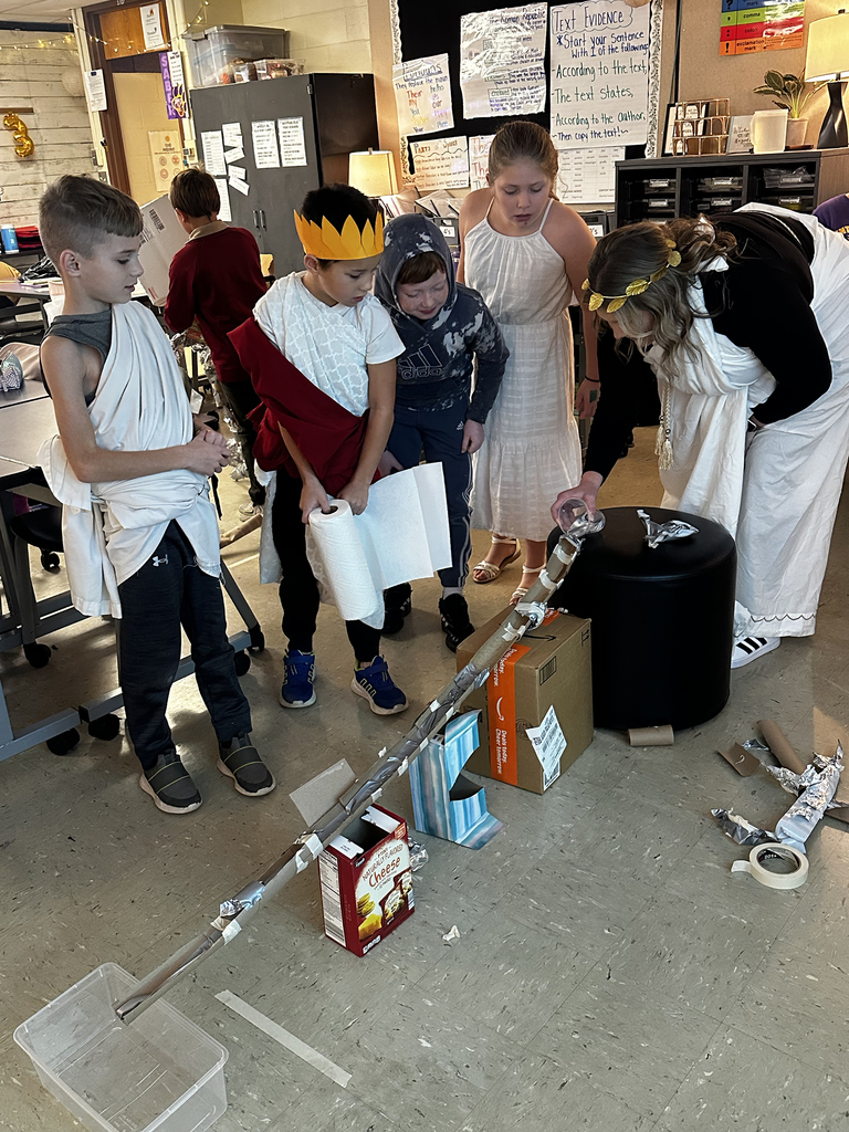 Third graders building and testing aquaducts