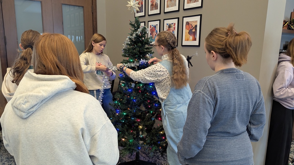 FFA and NHS students decorating Christmas trees at Fieldstone Senior Living