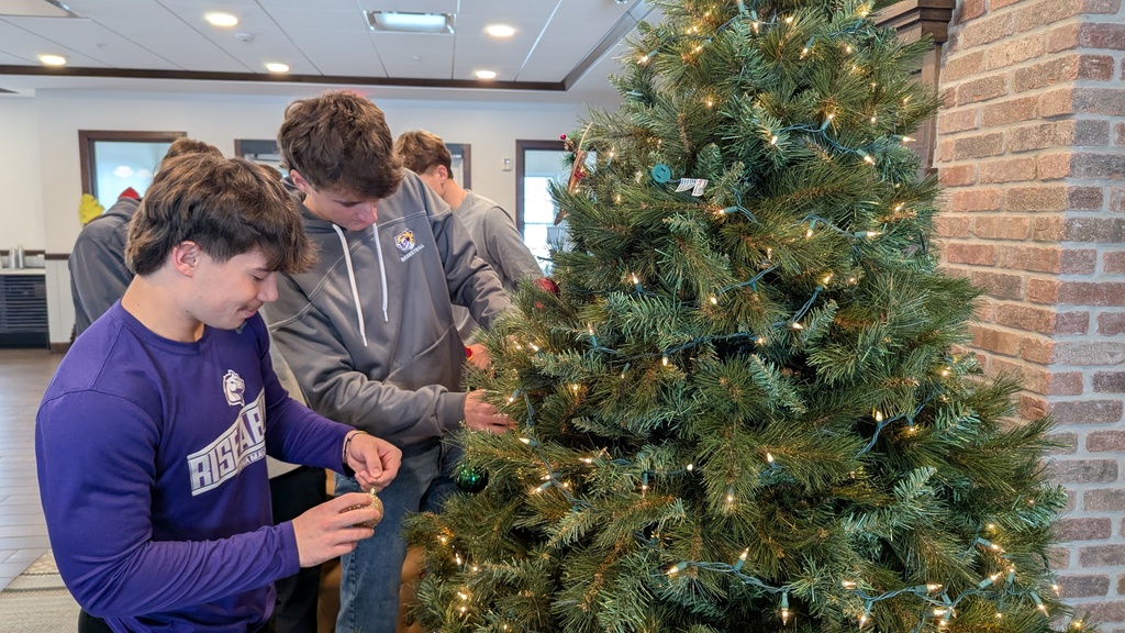 FFA and NHS students decorating Christmas trees at Fieldstone Senior Living