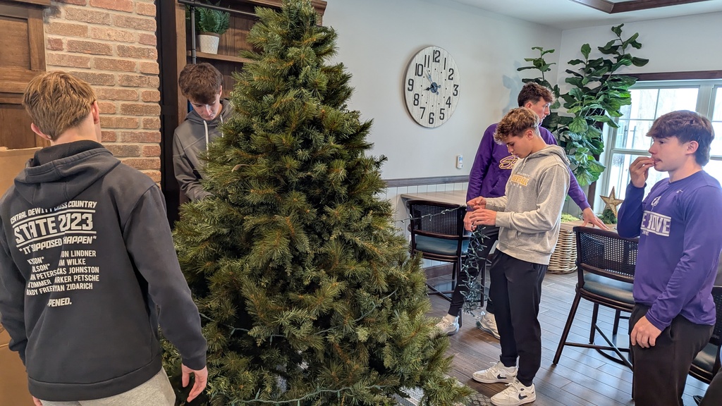 FFA and NHS students decorating Christmas trees at Fieldstone Senior Living