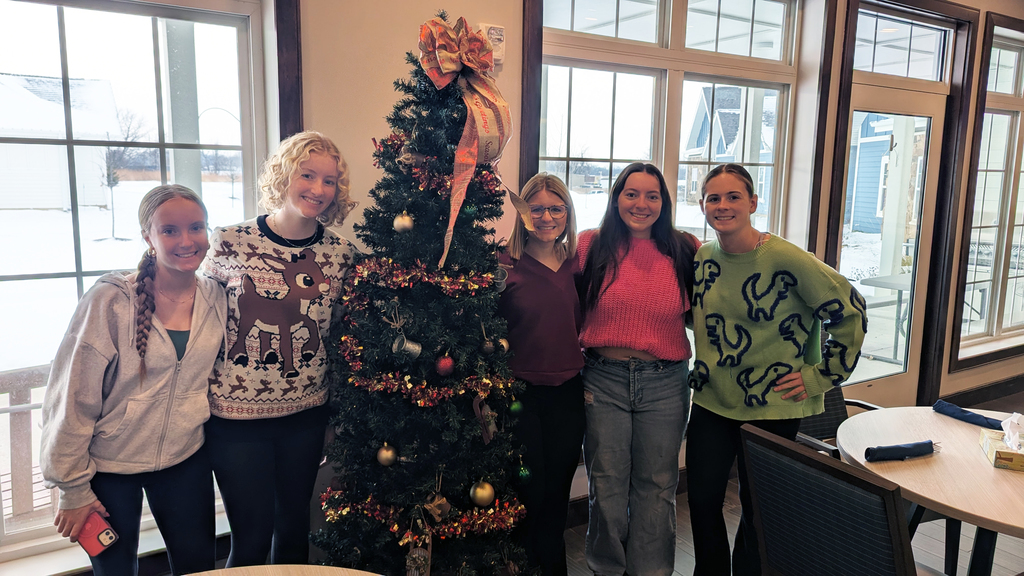 FFA and NHS students decorating Christmas trees at Fieldstone Senior Living