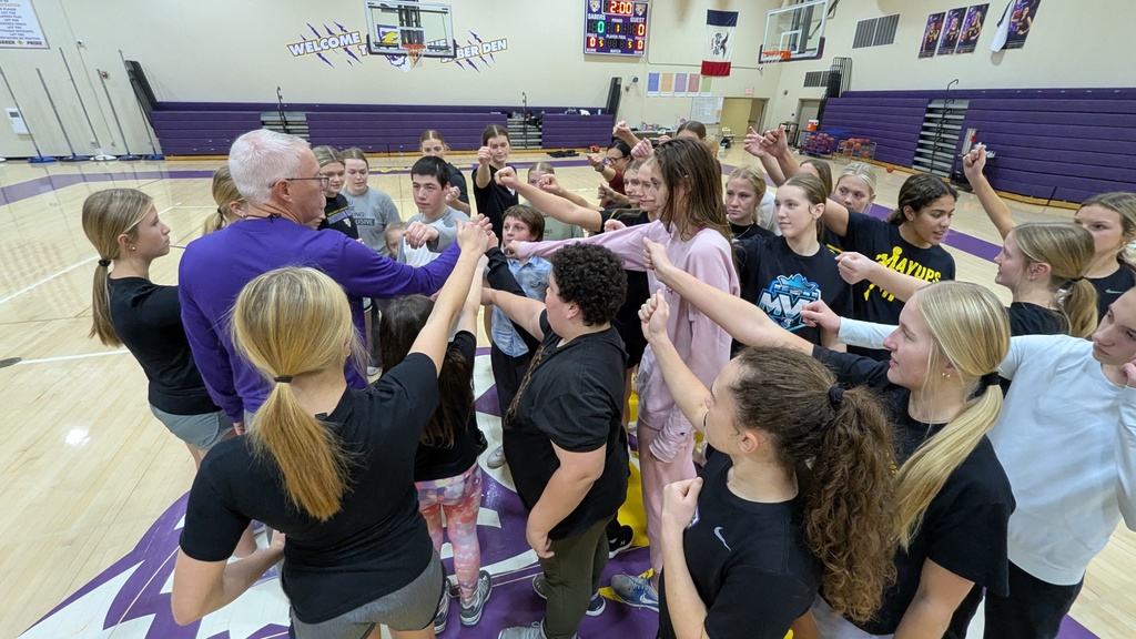 Saber girls basketball team and Unified Special Olympic athletes and partners practicing basketball