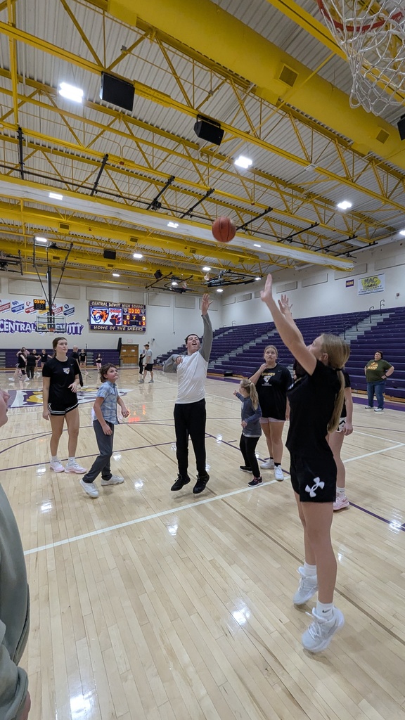 Saber girls basketball team and Unified Special Olympic athletes and partners practicing basketball