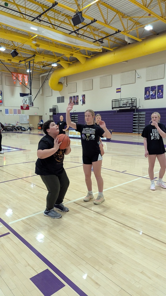 Saber girls basketball team and Unified Special Olympic athletes and partners practicing basketball