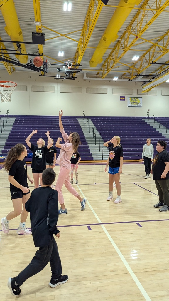 Saber girls basketball team and Unified Special Olympic athletes and partners practicing basketball