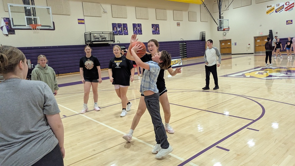 Saber girls basketball team and Unified Special Olympic athletes and partners practicing basketball