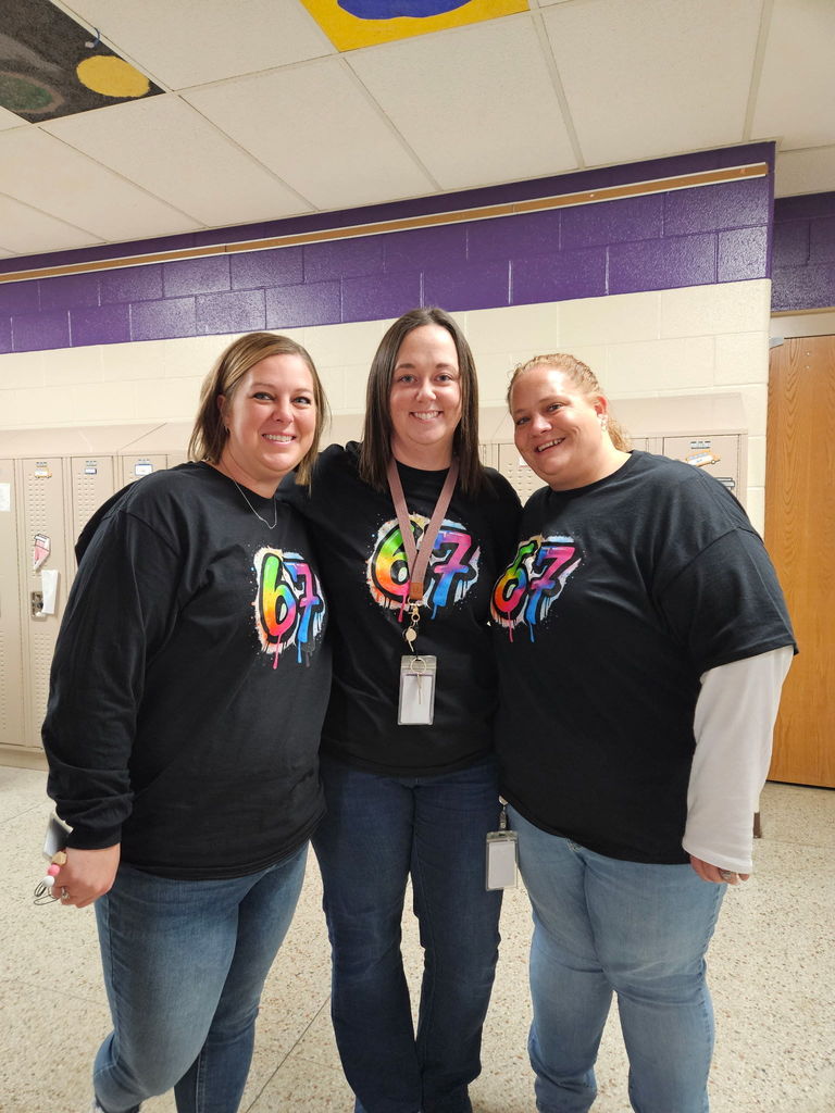 CDIS staff having fun surprising students with 6-7 celebration