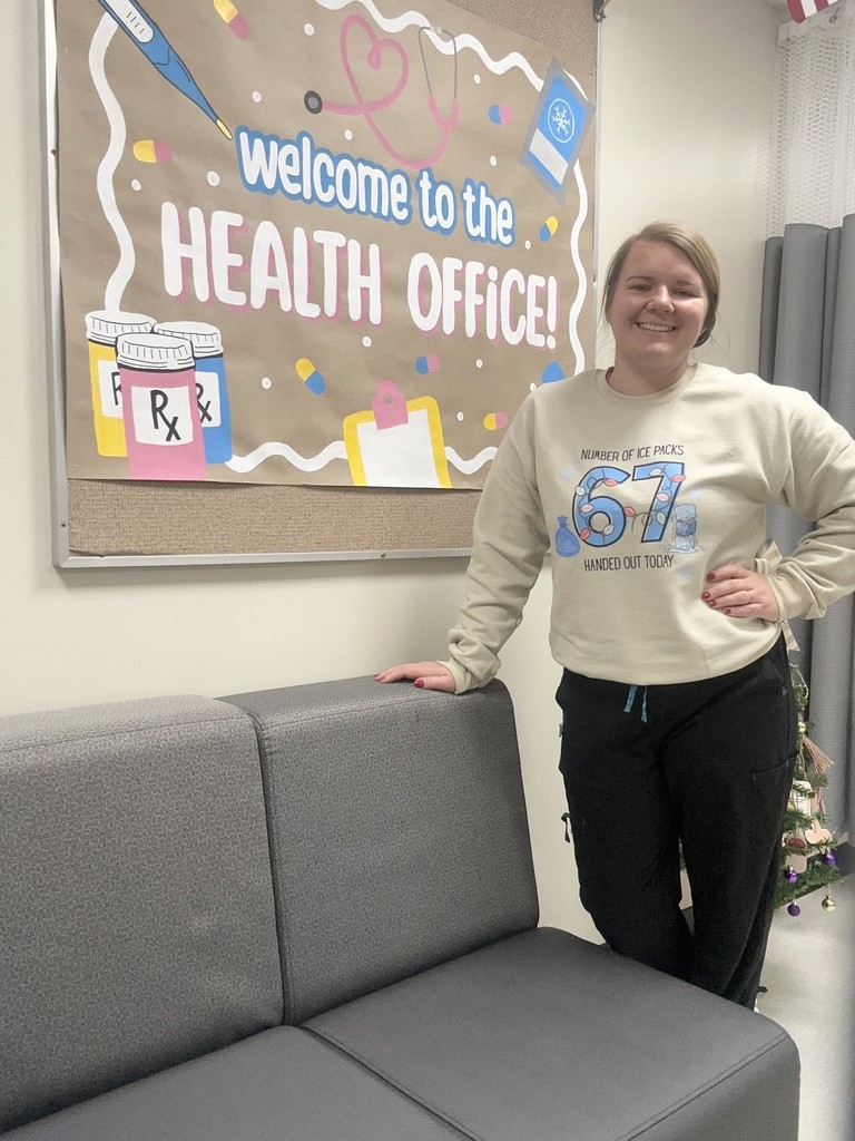Nursing assistant Mackenzie Riedesel showing off her 6-7 apparel