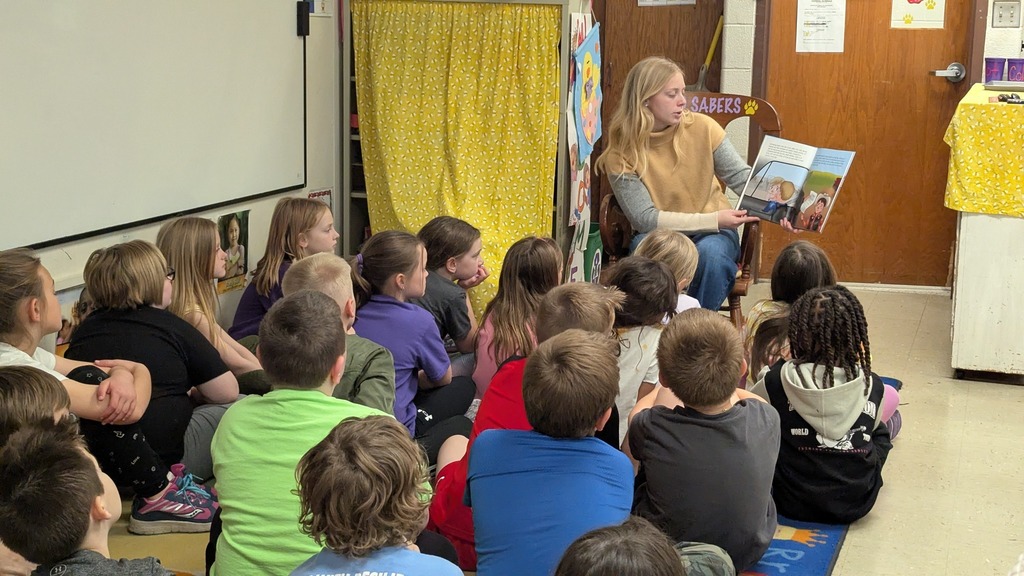 Central DeWitt graduate Katlin Truelsen reading the book she wrote to a 2nd grade class