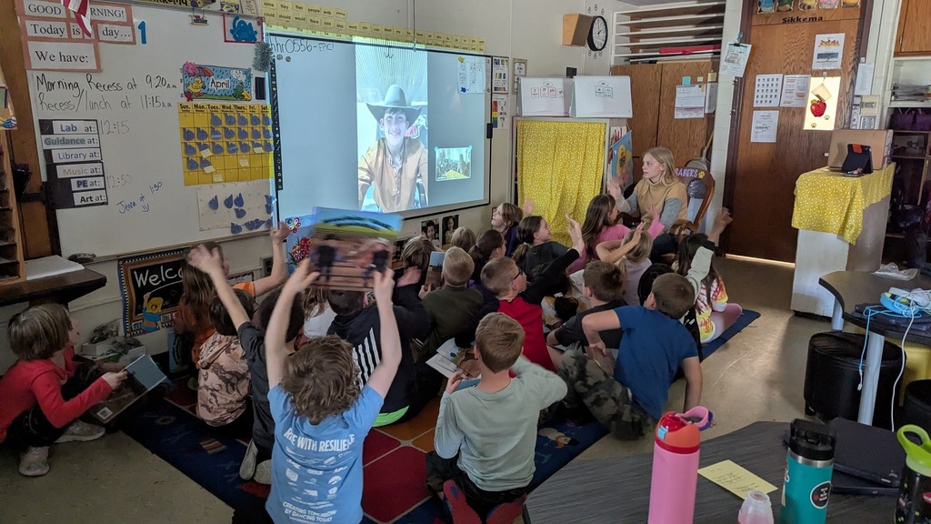 Central DeWitt graduate Katlin Truelsen and 2nd graders talking to Cade