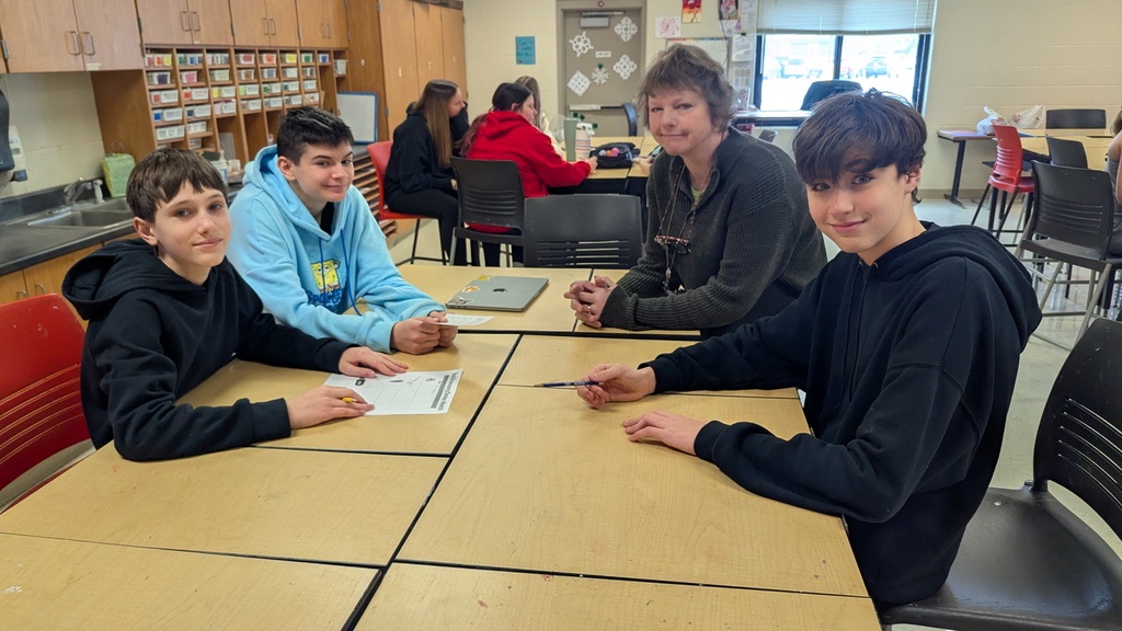 Middle school students solving puzzles to learn about careers