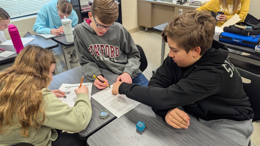 Middle school students solving puzzles to learn about careers