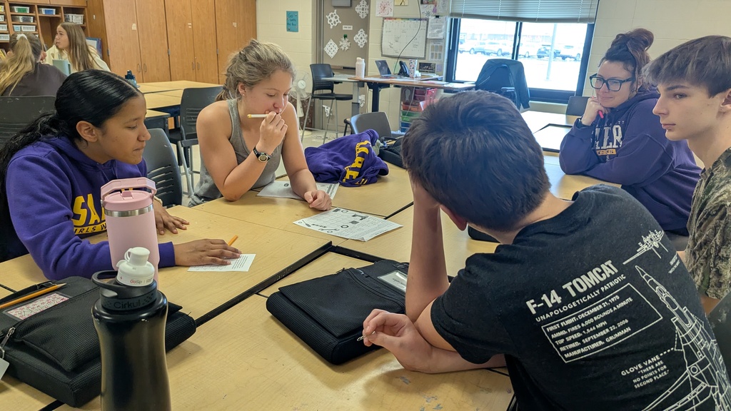 Middle school students solving puzzles to learn about careers