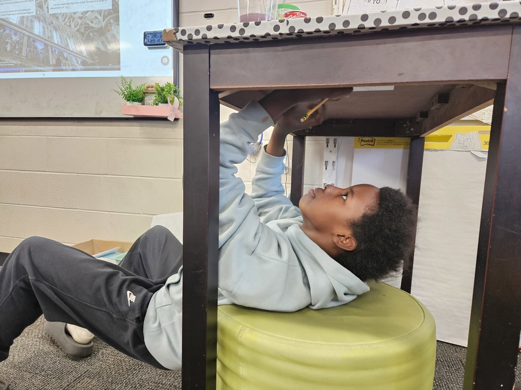 Just like Michelangelo painting the ceiling of the Sistine Chapel, 5th graders challenged themselves to create art using the underside of their desks 