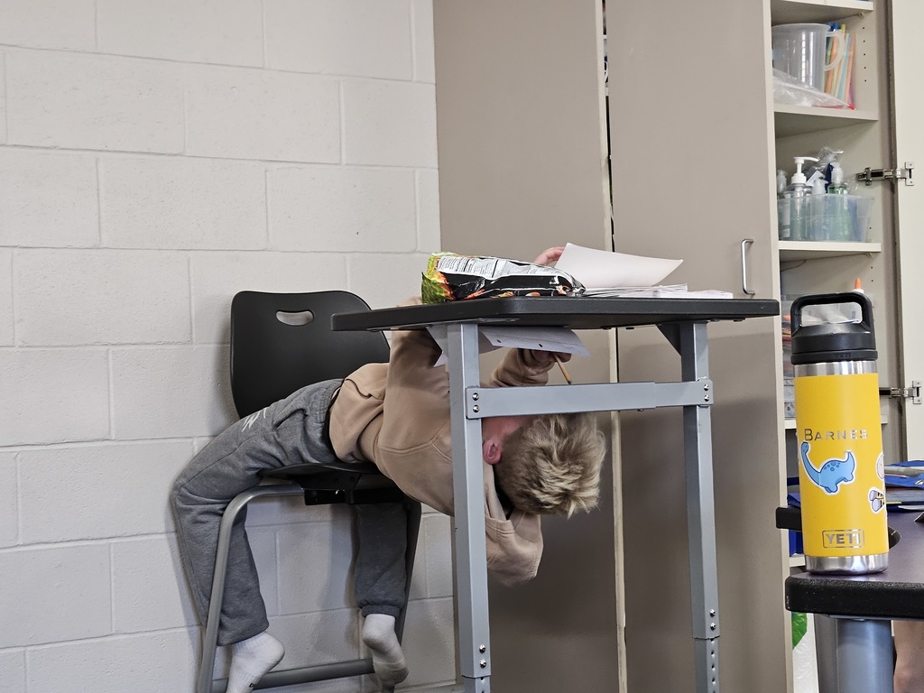 Just like Michelangelo painting the ceiling of the Sistine Chapel, 5th graders challenged themselves to create art using the underside of their desks 