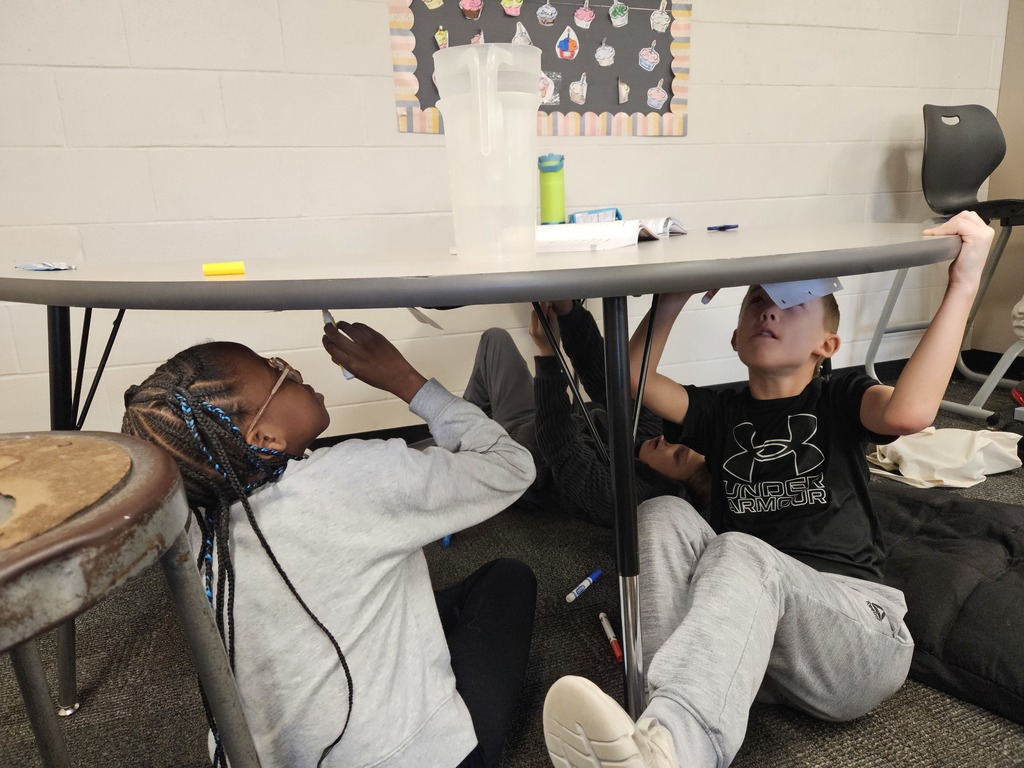 Just like Michelangelo painting the ceiling of the Sistine Chapel, 5th graders challenged themselves to create art using the underside of their desks 