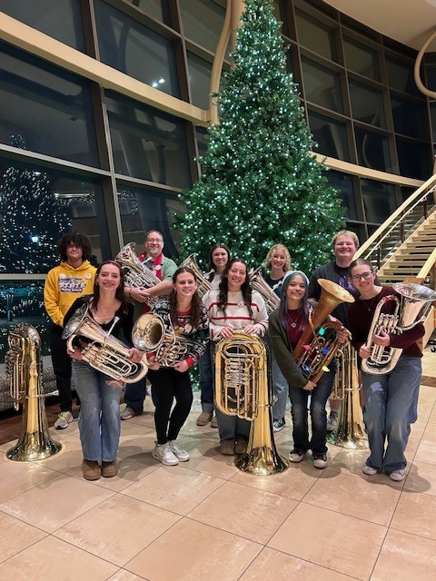 Alexander Brown, Eva House, Mr. Greubel, Melanie Miller, Emily Sutton, Sophie House, Anna Prosise, Oliva Lopez, Kelton Collins, Gracie Garrow at TUBACHRISTMAS in Dubuque