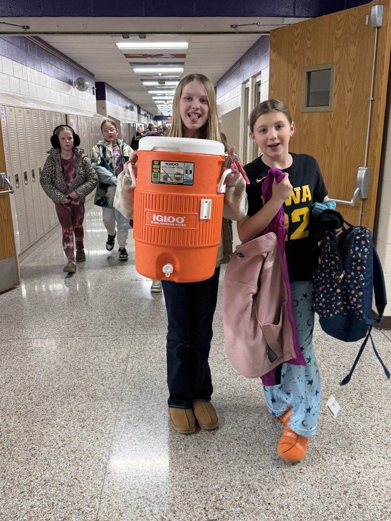 Student using a cooler as a backpack