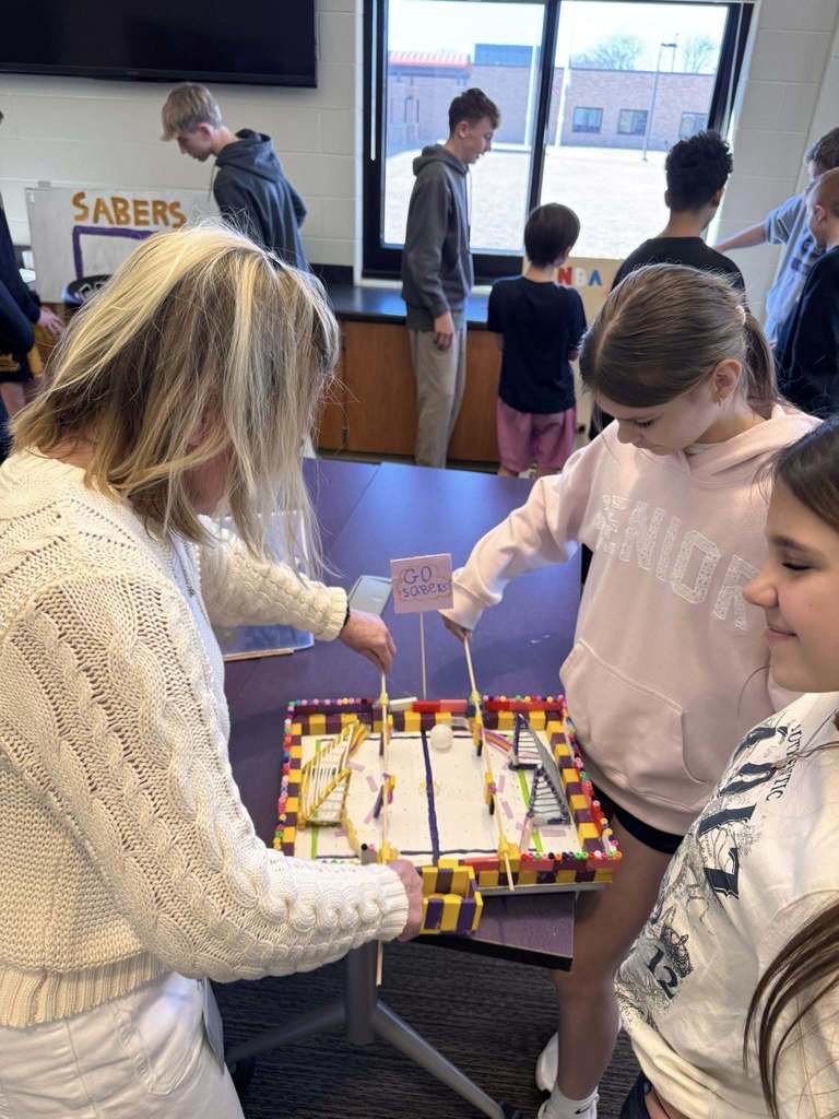 Students playing arcade games built by STEM 7 class