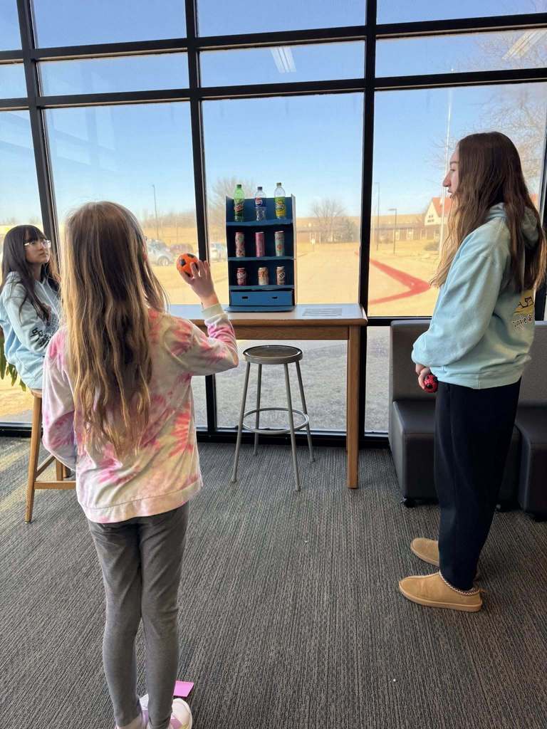 Students playing arcade games built by STEM 7 class