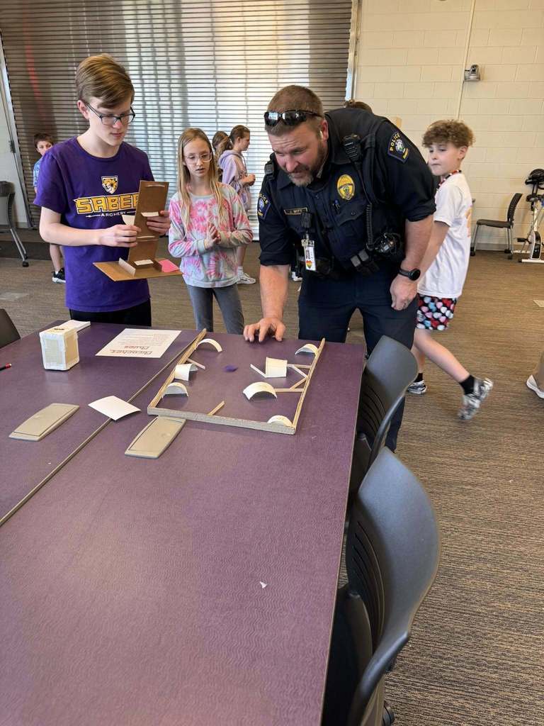 Students playing arcade games built by STEM 7 class