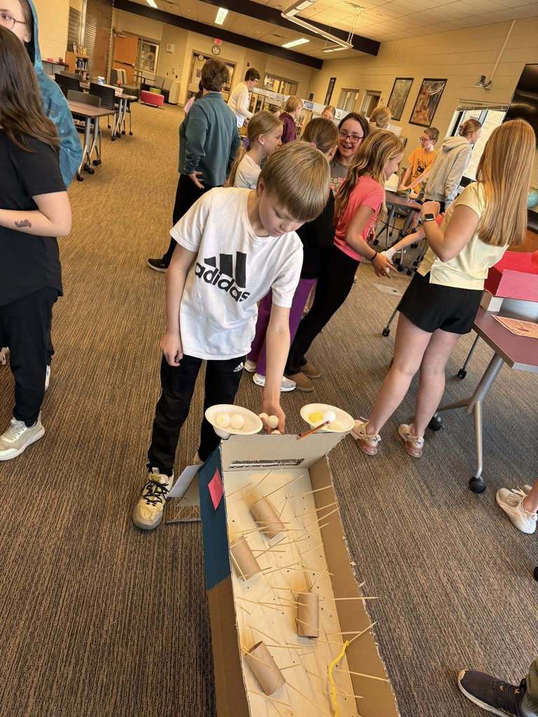 Students playing arcade games built by STEM 7 class