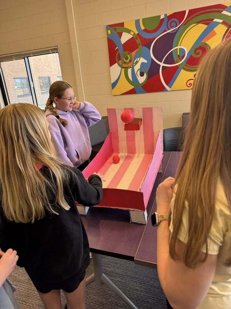 Students playing arcade games built by STEM 7 class