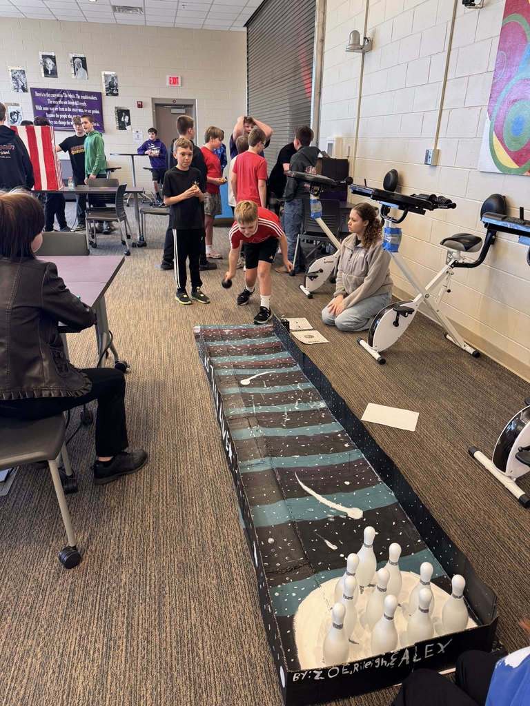 Students playing arcade games built by STEM 7 class