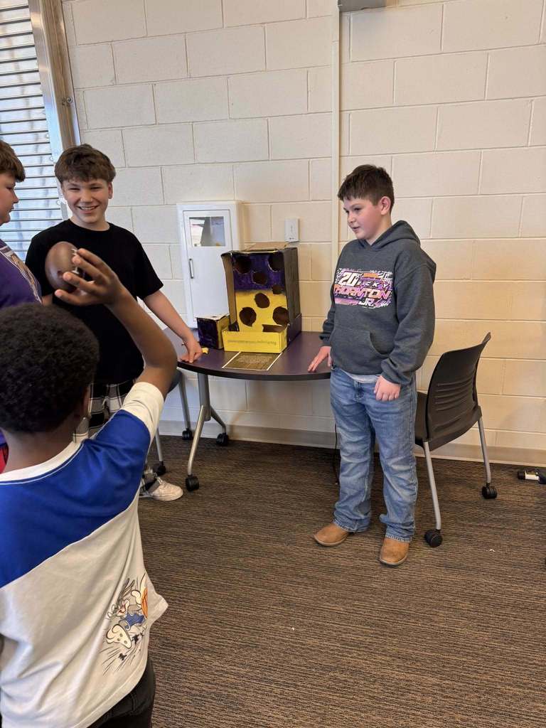 Students playing arcade games built by STEM 7 class