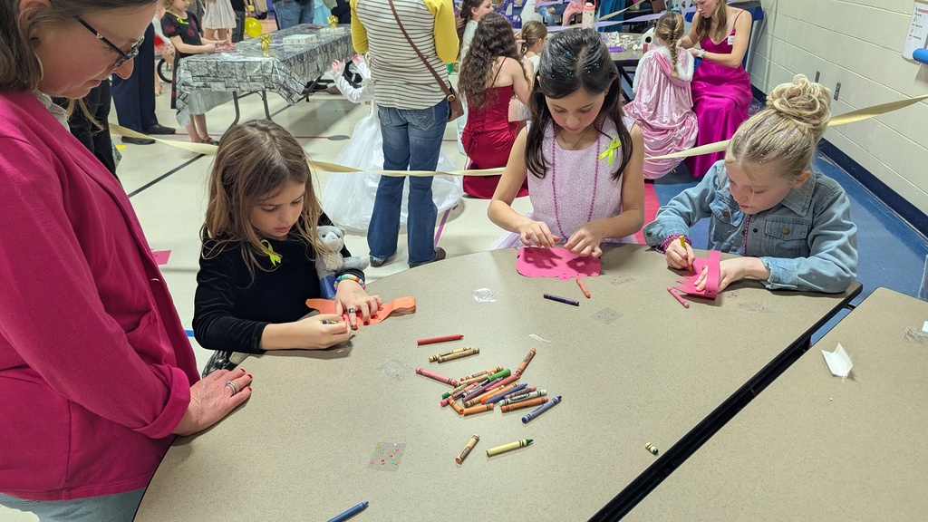 Kids making crowns at the Royal Ball