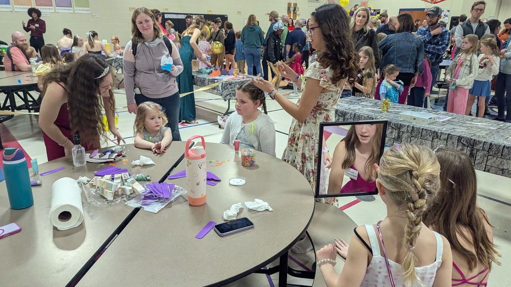 Girls getting their hair done at the Royal Ball