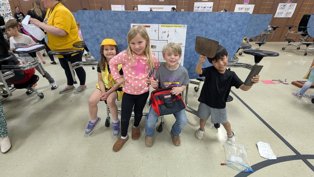 Kindergartners presenting what they learned about colonial trades
