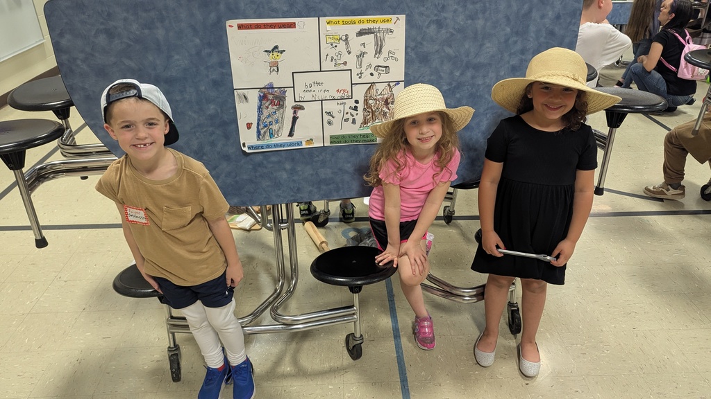 Kindergartners presenting what they learned about colonial trades