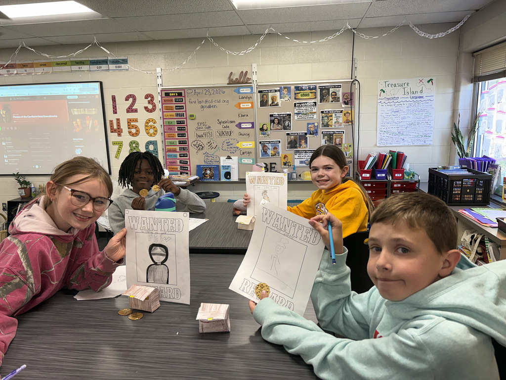 Students showing off their "wanted" posters