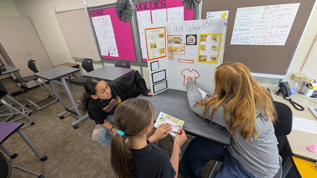 Students presenting their food truck concepts