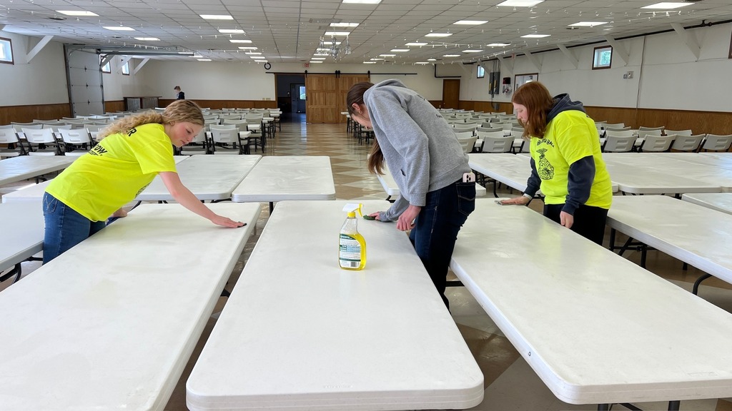 FFA students cleaning tables at Fairgrounds