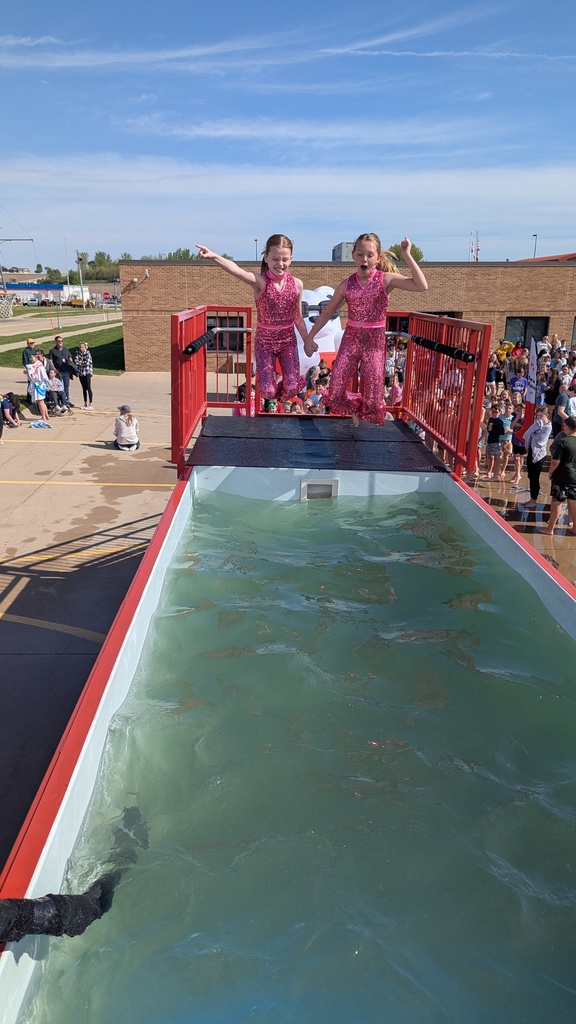 Disco divas having a great time jumping into the chilly waters