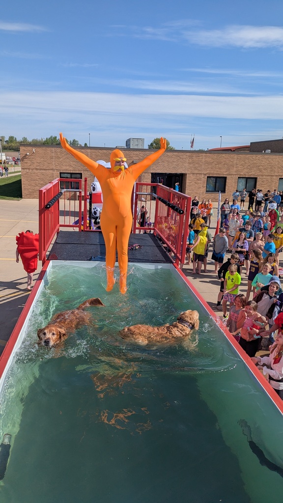 Sarah Berner dressed as the Lorax jumping into the tank