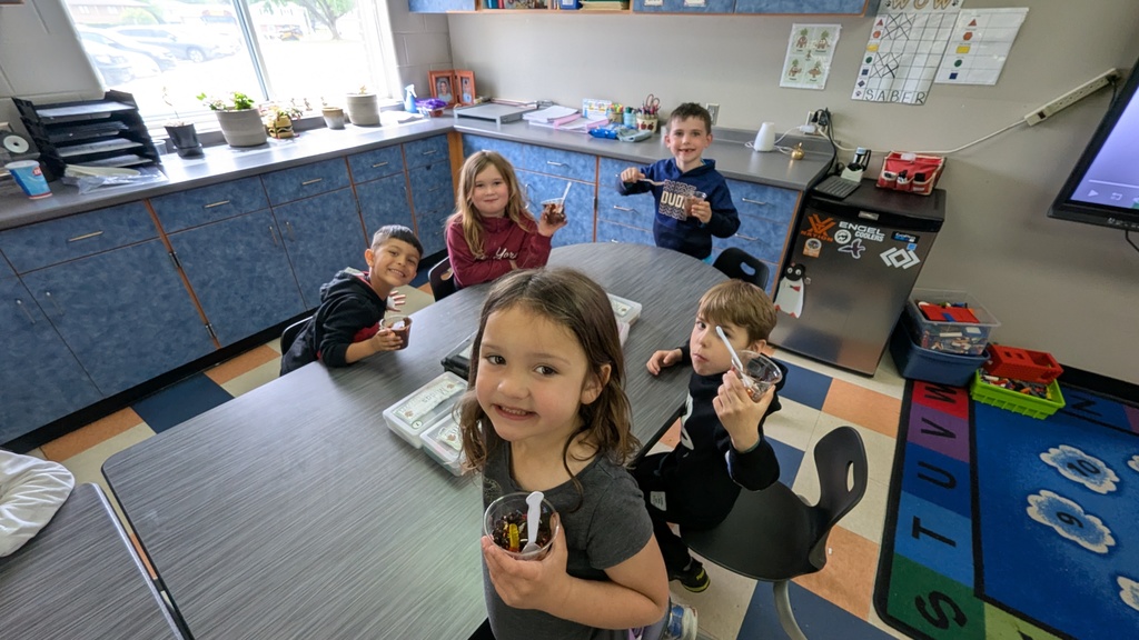 Kindergarteners enjoying their "dirt cups"