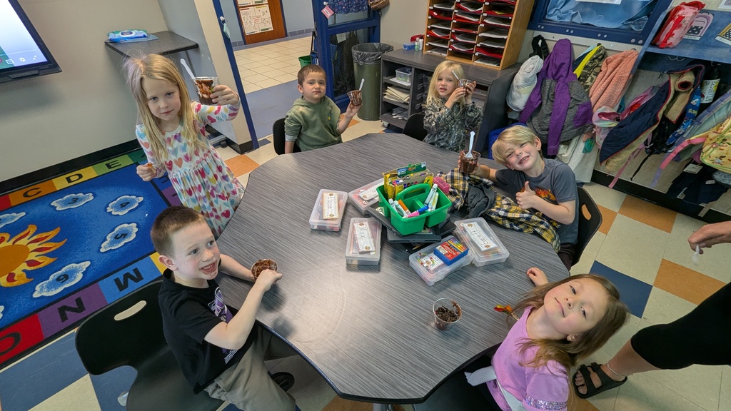 Kindergarteners enjoying their "dirt cups"