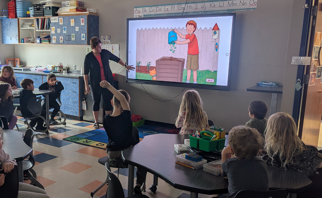 Mrs. Taylor teaching students about composting