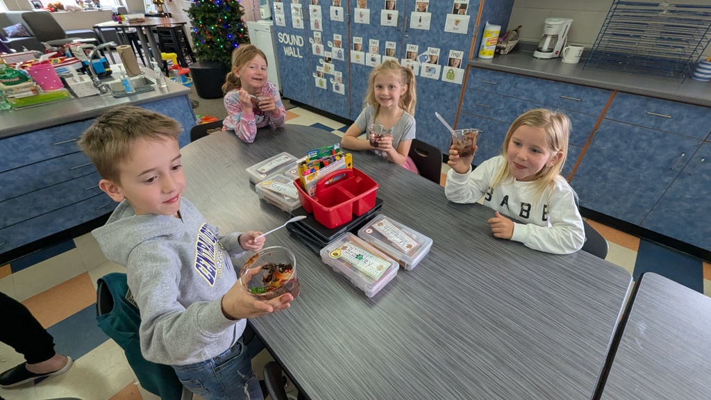 Kindergarteners enjoying their "dirt cups"