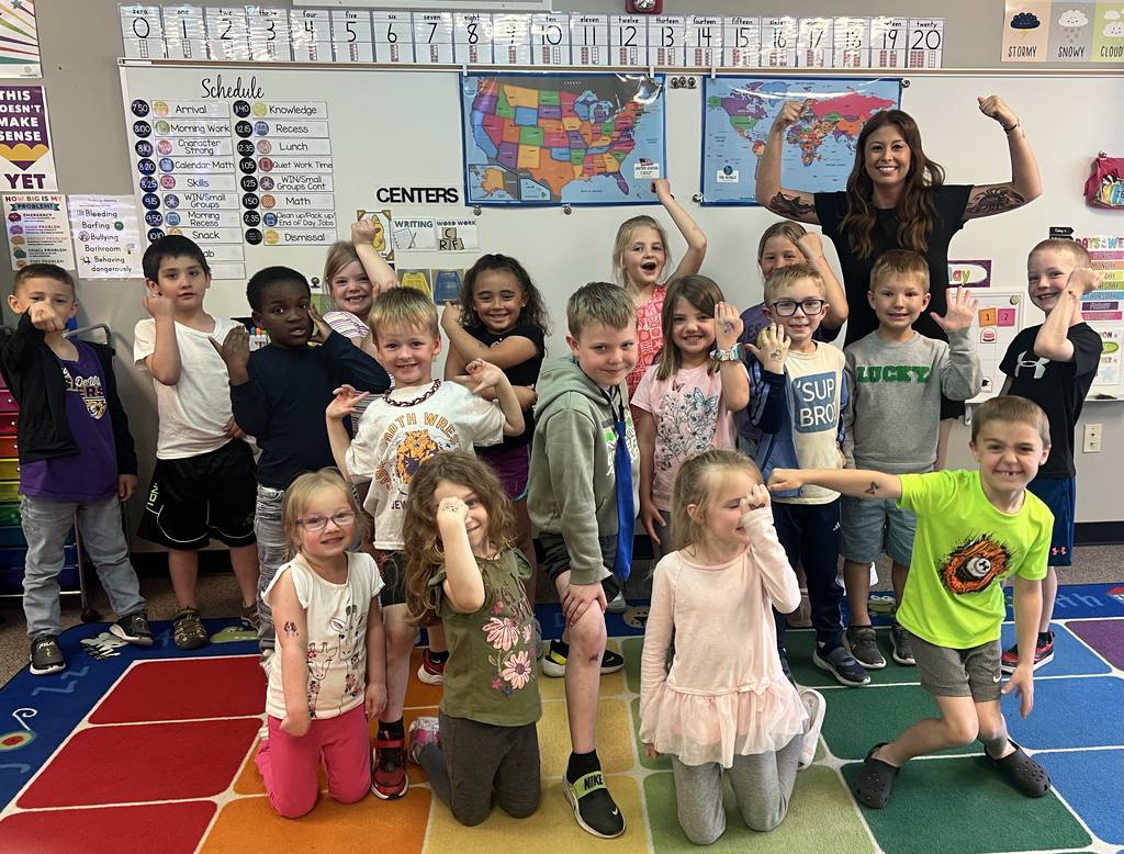 Ms. Wellman's class showing off their "tattoos"