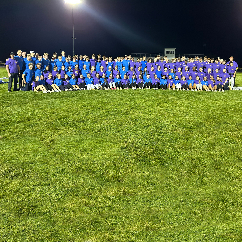 Central DeWitt and Walhert track & field teams wearing shirts in honor of Trisha Brookins