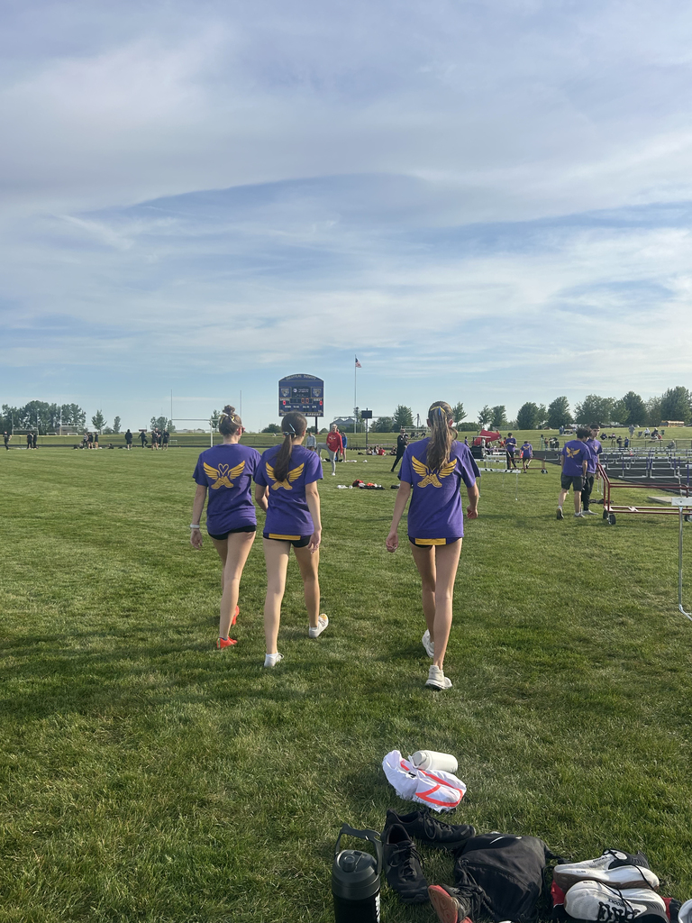 Central DeWitt and Walhert track & field teams wearing shirts in honor of Trisha Brookins