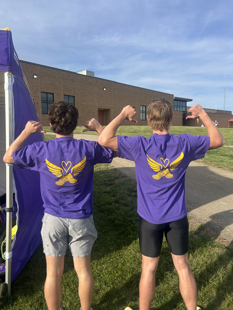 Central DeWitt and Walhert track & field teams wearing shirts in honor of Trisha Brookins
