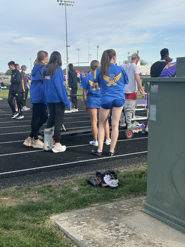 Central DeWitt and Walhert track & field teams wearing shirts in honor of Trisha Brookins