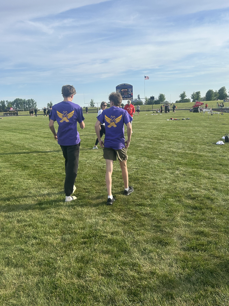 Central DeWitt and Walhert track & field teams wearing shirts in honor of Trisha Brookins